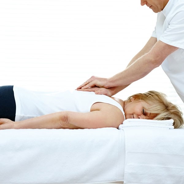 Hands-on chiropractic adjustment of a patient's back